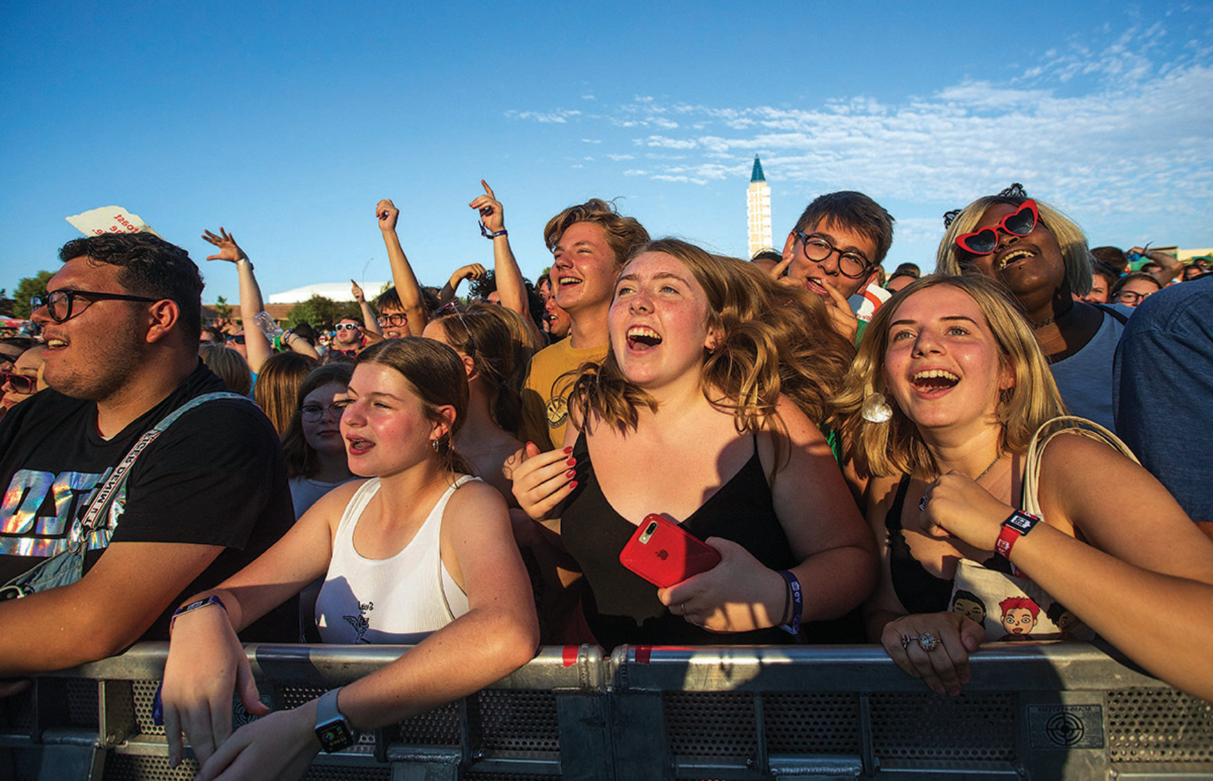 crowd cheering at an outdoor concert